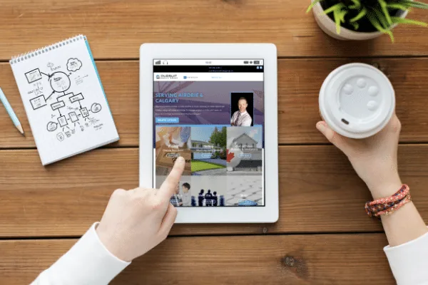 Reading the Pursuit Realty Group real estate blog on a tablet