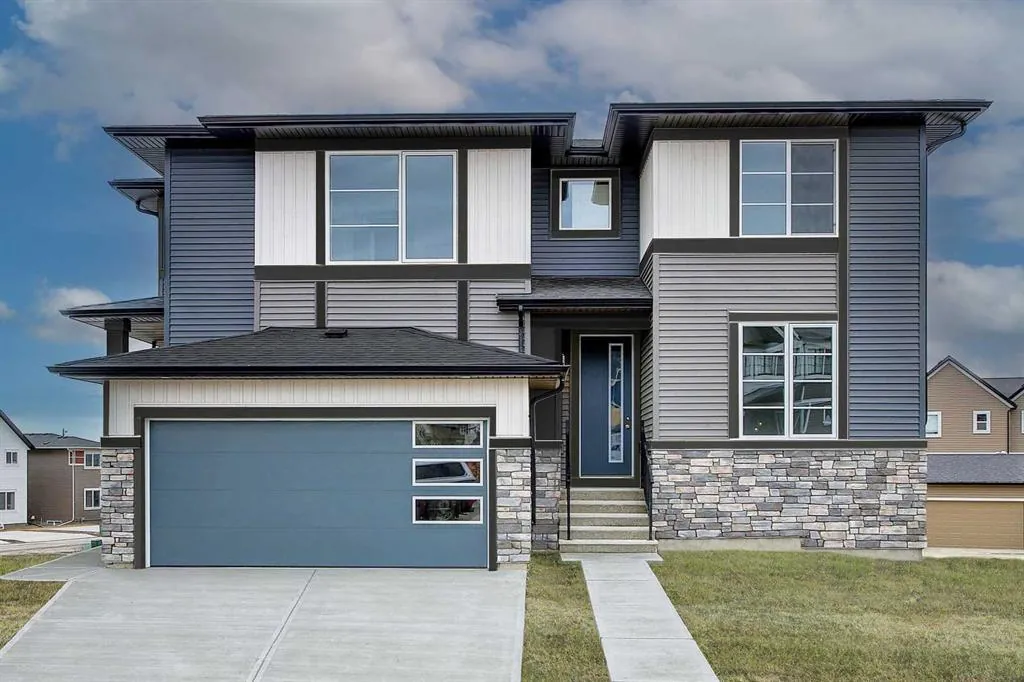 Modern two-storey home with stone accents on Lawthorn Way in Airdrie